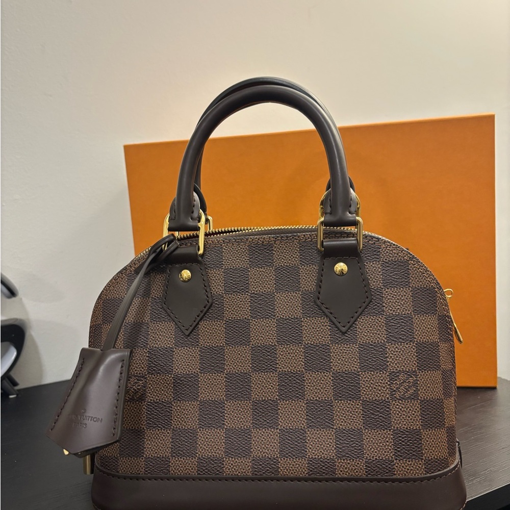 Louis Vuitton Alma BB handbag in Damier Ebene with receipt